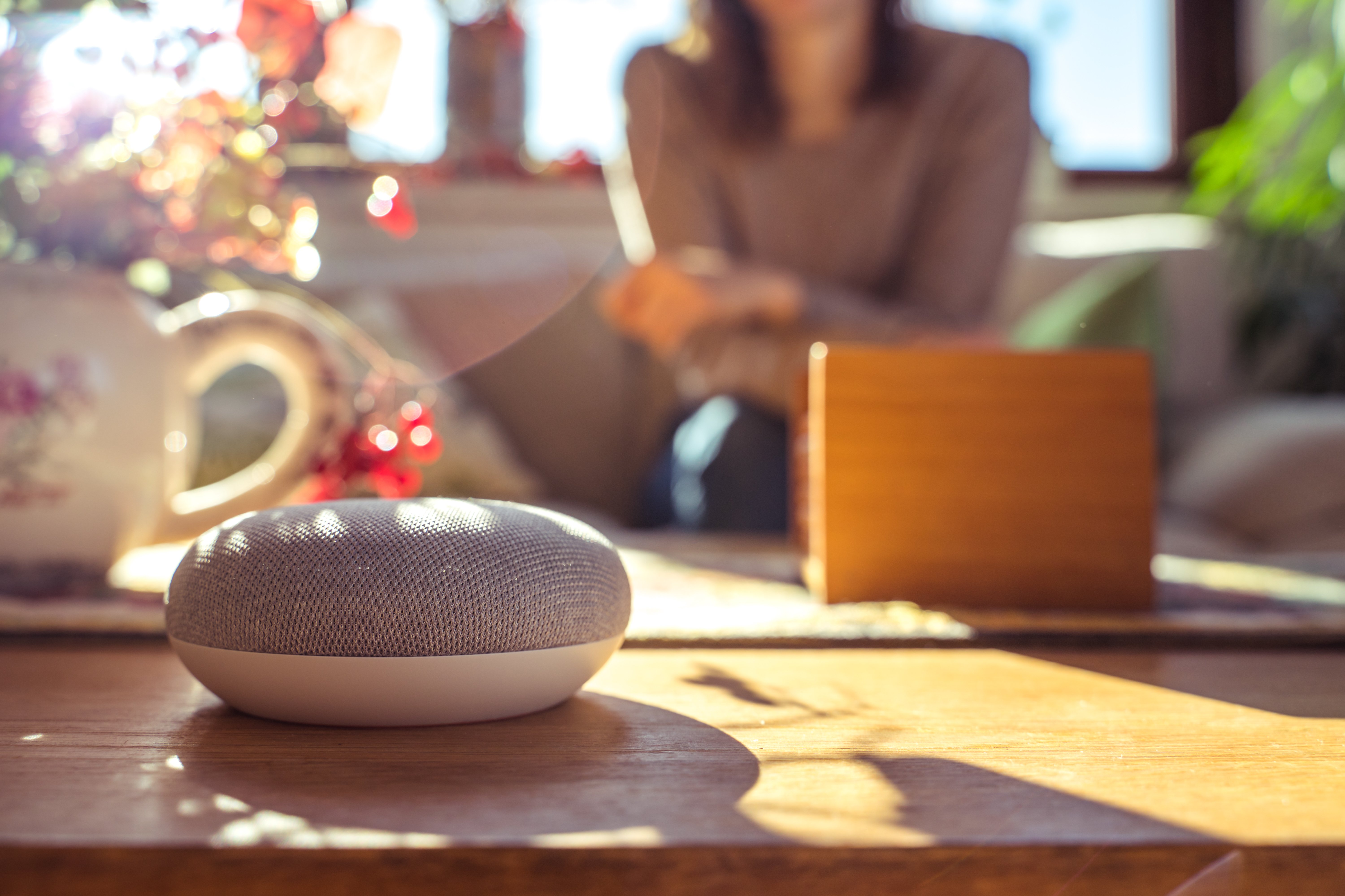 Google home on a sun-lit table.